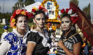 Woman wearing traditional outfits for Dios de Los Muertos, Day of the Dead, Hollywood Forever Cemetery