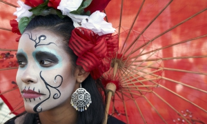 Woman wearing traditional outfits for Dios de Los Muertos, Day of the Dead, Hollywood Forever Cemetery