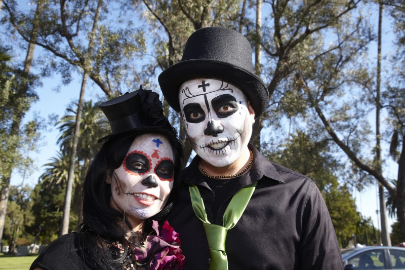 Couple dressed in costume at Day of the Dead (Dia de los Muertos) at Hollywood Forever Cemetery