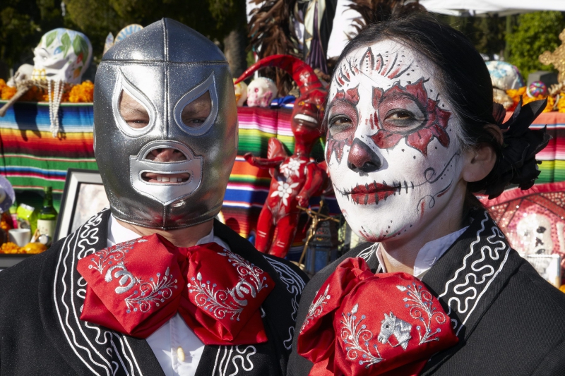 Man and woman dressed in costume at Day of the Dead (Dia de los Muertos) at Hollywood Forever Cemetery