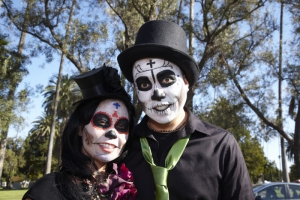 Couple dressed in costume at Day of the Dead (Dia de los Muertos) at Hollywood Forever Cemetery